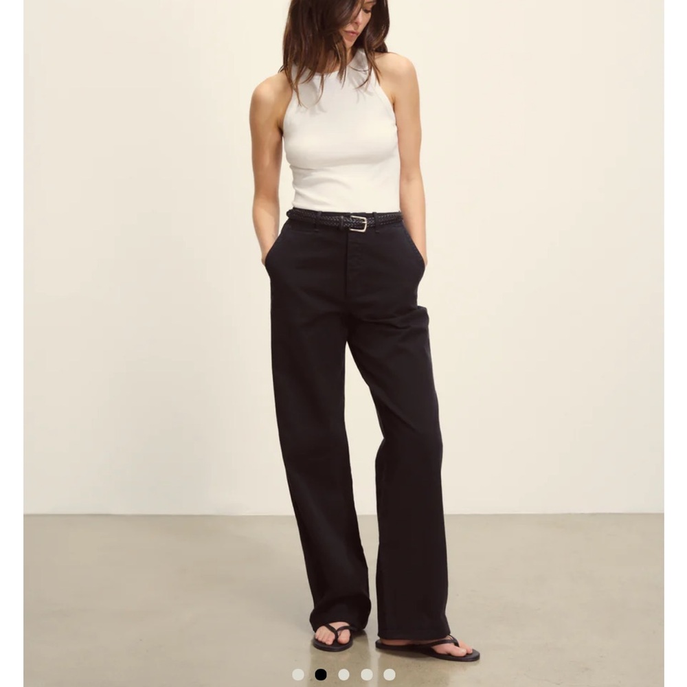 Black Buck Mason pants. Missing button (but extra buttons inside!)
